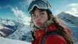 © Fotograf - A woman wearing a red jacket and goggles stands on a mountain, offering a scenic view
