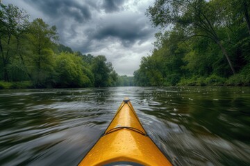 Wall Mural - A yellow kayak paddles down a winding river with lush greenery and calm water