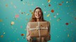 © Premium_art - Happy woman holding a gift box with confetti flying around. Celebration and surprise concept.