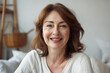 © Daniil - Middle-aged woman smiling in the room