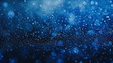 Wall Mural - Blue abstract background with glitter and shiny lights.