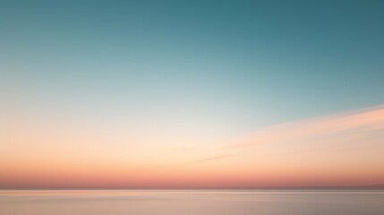 Tranquil seascape with a clear horizon, gentle waves and a peaceful sky.