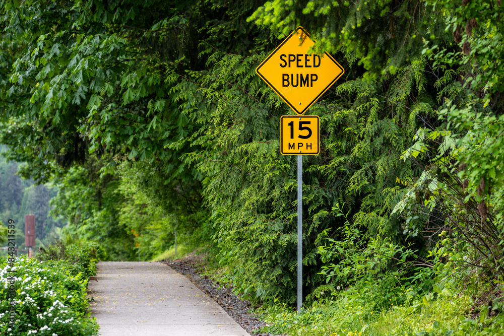 Roadside cement sidewalk and walking path being encroached on by new ...