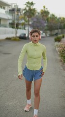 Wall Mural - A woman with headphones is jogging in a city, listening to music and enjoying her workout