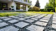 © PaulShlykov - Environmentally friendly eco-paving - Concrete lawn grid with gravel filling for surface unsealing at residential house parking lot