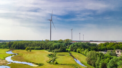 Windmill park or farm aerial drone view, wind mill turbines for generation electricity in the Netherlands, green clean energy production