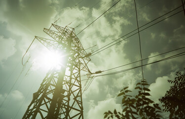 A closeup shot of an electric tower taken from the perspective looking up at it