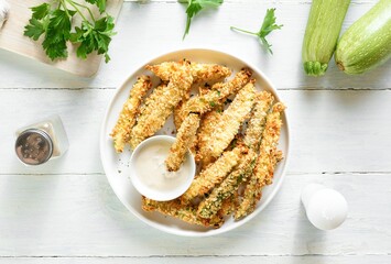 Wall Mural - Baked crispy zucchini fries with dipping sauce