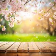 © Beibeinside - spring background with cherry blossom  flowers and table a light wooden empty table   green park is visible in the background.  for Product placement