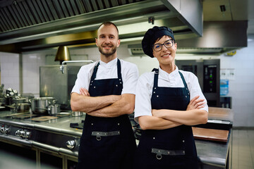 Wall Mural - Portrait of confident chefs in  kitchen in restaurant looking at camera.