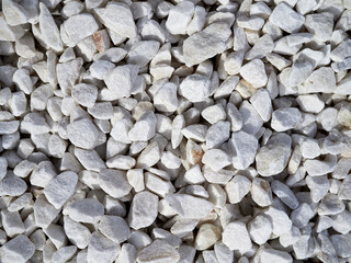 Texture of white decorative stones. White gravel