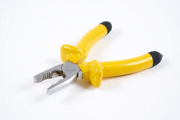 Yellow pliers on white background