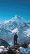 © banthita166 - Serene Hiker Admiring Snowy Himalayan Peaks - Backview of Person with Trekking Pole Contemplating Majestic Mountain Range