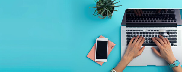a person typing on an iPhone with a laptop and office accessories in front of a solid blue background. Web banner with copy space on the right