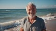© LukaszDesign - Portrait, beach, joyful old man with retirement, summer vacation, Canada, and wellbeing. Face, senior, or tourist on beach vacation, weekend getaway, or peaceful smile