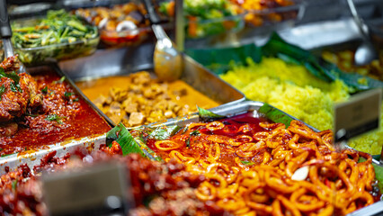 Wall Mural - Traditional Asian dishes sold in a food court in Singapore