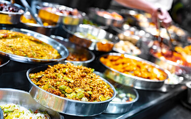 Wall Mural - Traditional Asian dishes sold in a food court in Singapore