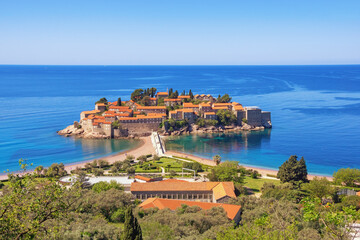 Wall Mural - Beautiful Mediterranean landscape. Montenegro, Adriatic Sea. View of the Sveti Stefan Island on sunny day