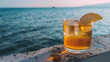 © Oleksandr - A bronze cider with a sprinkle of cinnamon and an apple wedge. Positioned in a tasteful tumbler on the brink of a concrete platform. Gazing at the violet sea.