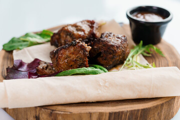 Wall Mural - Pork steak with sauce on a wooden board