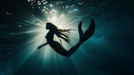 Wall Mural - Beautiful mermaid swimming underwater in deep sea.