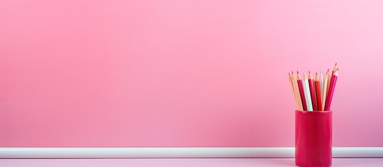 Aufkleber - Pink paper on a pink background with a colored pencil to color the world Minimal flat lay. copy space available