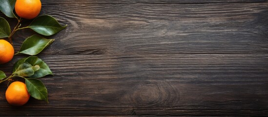 Poster - The copy space image features a weathered wooden surface with an orange fruit adorned with leaves