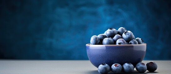 Fresh blueberries background with copy space for your text Blueberry antioxidant organic superfood in a bowl concept for healthy eating and nutrition