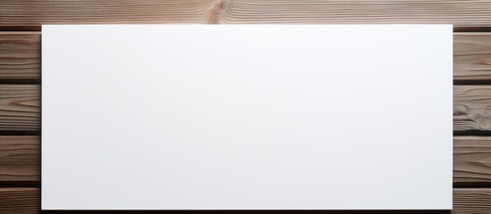 Fototapete - Blank white paper on white wood background mock up. copy space available