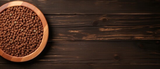 Poster - Top view of dog food in bowl with empty wooden background for text input Pet food concept. copy space available