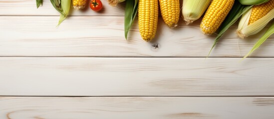 Poster - Fresh yellow corn on a white wooden table Vegetables Top view Copy space