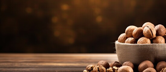 Poster - Macadamia nuts in the craft package and peeled walnuts in the brown bowl on wooden table close up. copy space available