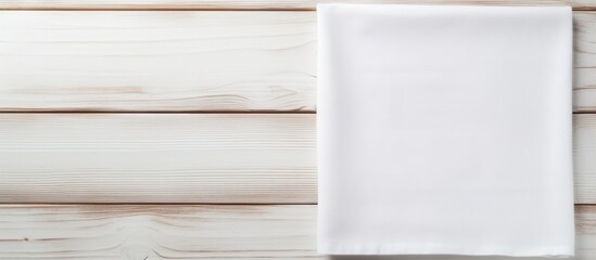 Poster - Napkin Cloth napkin on white wooden background Top view mockup. copy space available