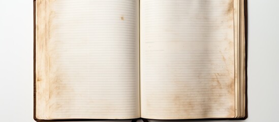 Leinwandbilder - An open empty old notebook isolated on a white background Copy space