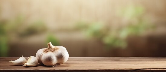 Poster - Garlic on a plate Fresh garlic on a wooden background Top view Copy space