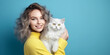 © Nitcharee - close-up of a woman and a cat ,Pretty young woman with cute tabby cat ,animals, pets, relationship, friendship