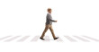 © Ljupco Smokovski - Full length profile shot of an elderly gentleman walking at a pedestrian crossing