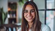 © AkuAku - Attractive female professional smiling while standing in the office