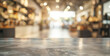 © Lull - Empty marble table top with blurred coffee shop background. Ideal for product placement, this image features a clean marble countertop set against a warm and inviting coffee shop backdrop.