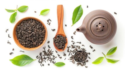 Wall Mural - oolong tea leaves in wooden spoon and clay pot on white background top view