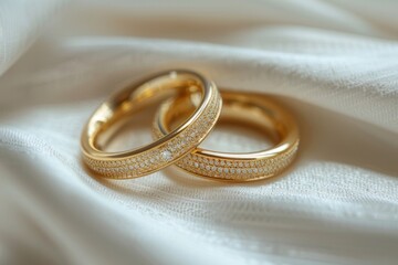 Canvas Print - Wedding gold rings on a background of silk fabric