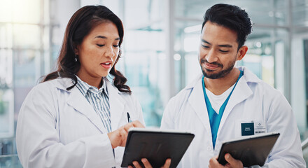 doctors, man and woman with tablet, discussion or check results for medical services at hospital. pe