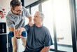 © peopleimages.com - Weight, senior man and physiotherapy with helping, wellness and client assessment at doctor. Consultation, rehabilitation and arm exercise from physical therapy and recovery of patient with care