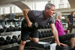 © ReadyAtTheEase/peopleimages.com - Fitness, weights and senior man in gym for workout, training and cardio exercise for healthy body. Retirement, sports and person with dumbbell equipment for wellness, muscle strength and mobility