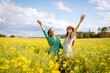 © maxbelchenko - Two Beautiful women in dress enjoys summer time, spending leisure time, gathering wild flowers.