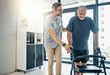 © peopleimages.com - Physiotherapist, walking frame and old man for rehabilitation, consulting and recovery. Healthcare, physical therapy and senior person with disability help for medical service, wellness and support