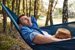 © baranq - Relaxed adult man in hammock