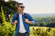 © baranq - Happy man during weekend hiking trip
