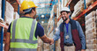 © peopleimages.com - Men, shaking hands and warehouse for deal with logistics, smile and contract for global shipping company. People, handshake and happy for agreement, collaboration and supply chain for distribution