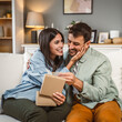 © Miljan Živković - Girlfriend open her birthday present from her boyfriend at home
